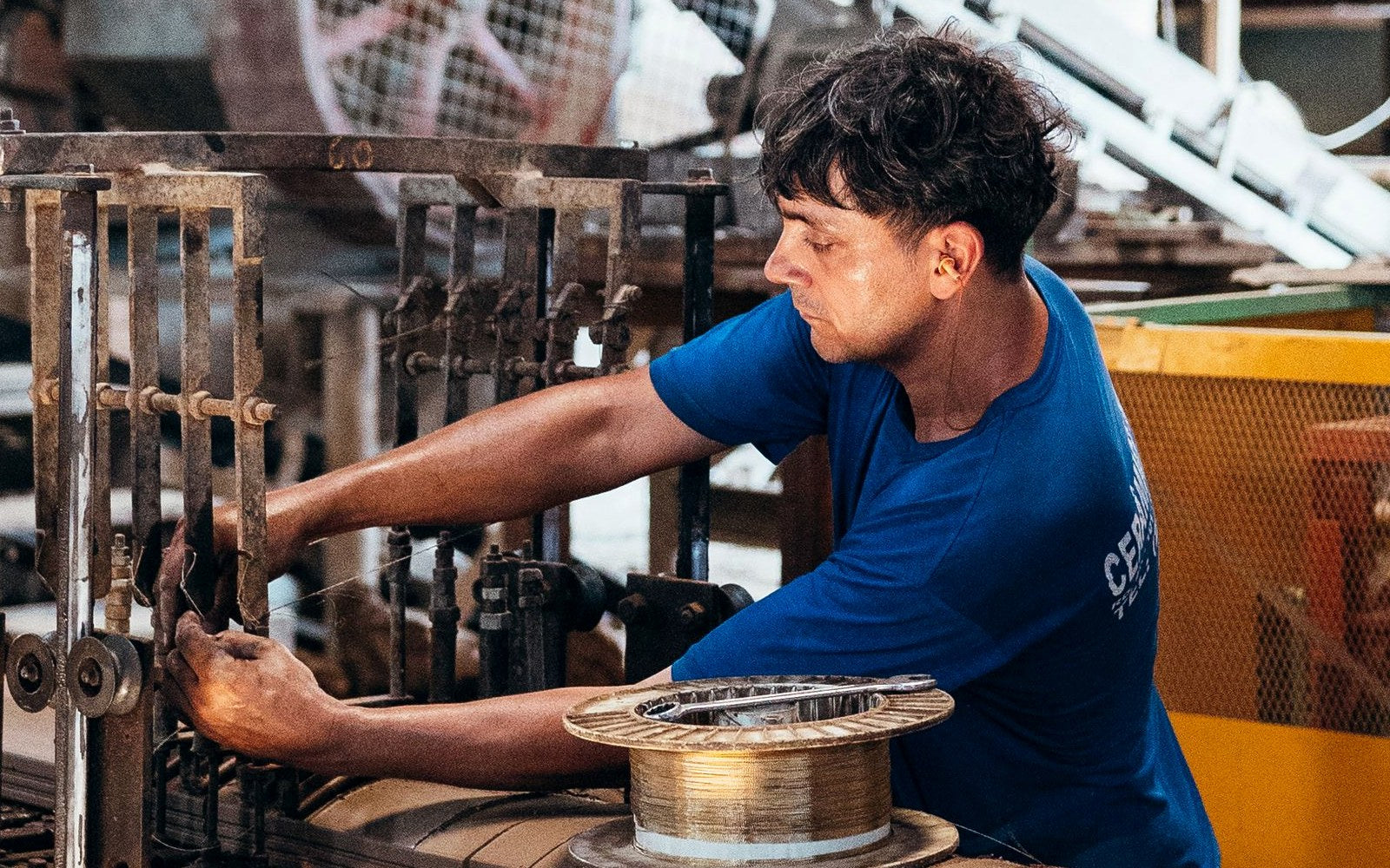 Industrial worker operating production machinery